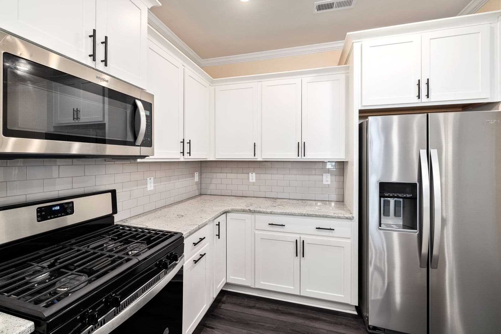 Shaker kitchen with tiled splashback